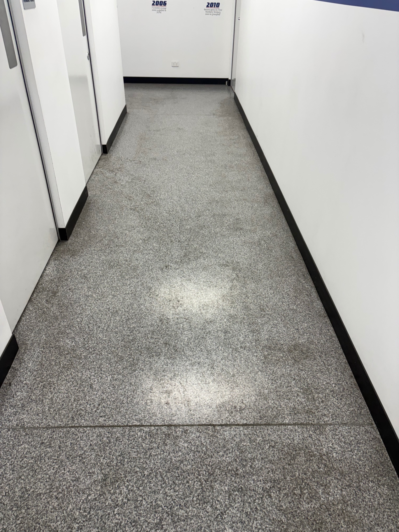 Office corridor — stripped, sealed and polished before professional office cleaning